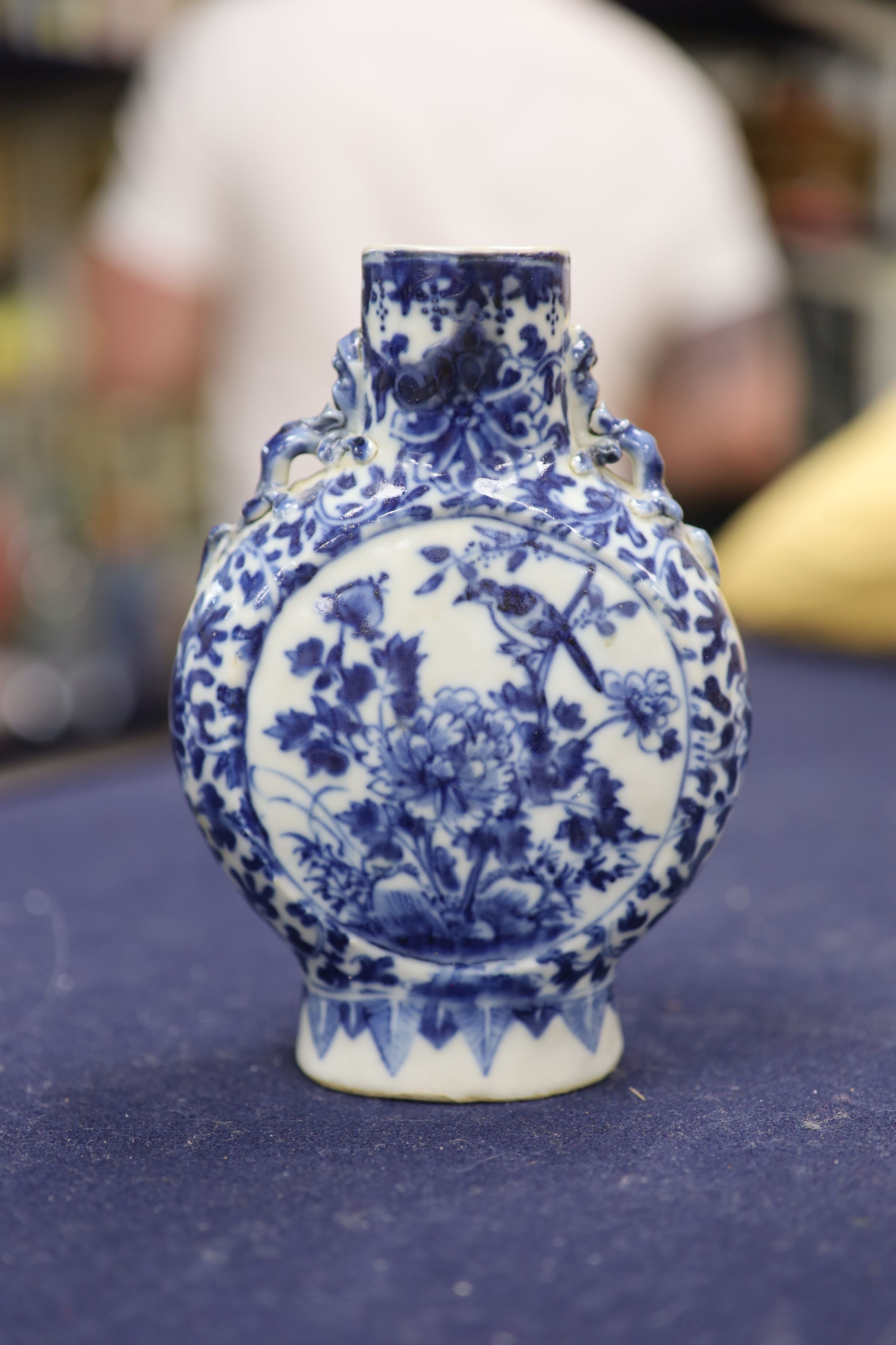 Two 19th century Chinese blue and white moon flasks and a teapot, tallest 21cm